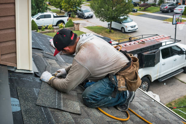 Professional Flat Roof Repair technician working in North Palm Beach, FL